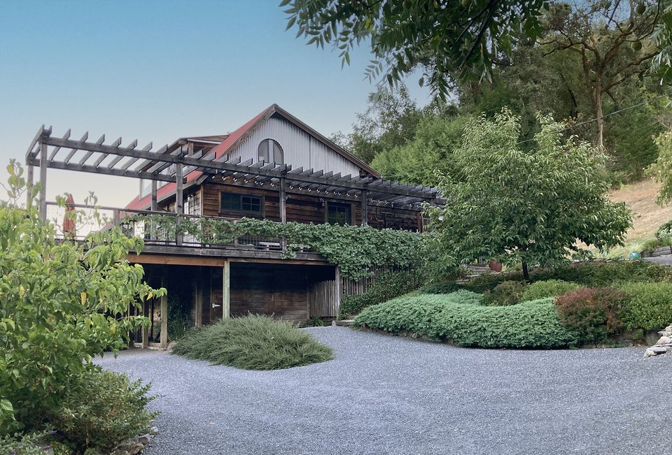 Main House with pergola and gravel drive