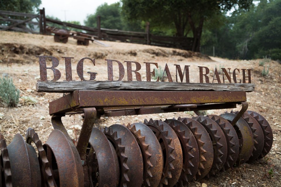 Big Dream Ranch sign on an old disc harrow